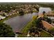 Scenic aerial view of a lakeside community featuring well-maintained landscaping and charming homes at 4057 Crockers Lake Blvd # 15, Sarasota, FL 34238
