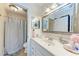 Clean bathroom with a large mirror, updated fixtures, and neutral tones that enhance the space at 4057 Crockers Lake Blvd # 15, Sarasota, FL 34238