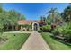 Community clubhouse featuring lush landscaping, offering a great spot for social gatherings at 4057 Crockers Lake Blvd # 15, Sarasota, FL 34238