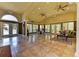 Large community clubhouse with tile floors, high ceilings, ceiling fans, and large windows at 4057 Crockers Lake Blvd # 15, Sarasota, FL 34238