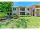 Charming two-story condo featuring well-maintained landscaping and outdoor spaces with stairs at 4057 Crockers Lake Blvd # 15, Sarasota, FL 34238