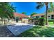 Community grilling area featuring well-maintained grills and a shaded picnic space, perfect for outdoor gatherings at 4057 Crockers Lake Blvd # 15, Sarasota, FL 34238