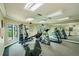 Bright and airy community gym featuring mirrored walls, state-of-the-art equipment, and scenic views at 4057 Crockers Lake Blvd # 15, Sarasota, FL 34238