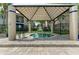 Relaxing community hot tub under a covered gazebo, offering a private and serene setting at 4057 Crockers Lake Blvd # 15, Sarasota, FL 34238
