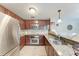 Kitchen features granite countertops, tile backsplash, stainless steel appliances, and ample cabinets at 4057 Crockers Lake Blvd # 15, Sarasota, FL 34238