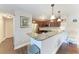 Stylish kitchen with stainless steel appliances, granite countertops, and ample cabinet space at 4057 Crockers Lake Blvd # 15, Sarasota, FL 34238