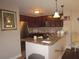 Well-lit kitchen with stainless steel appliances and granite countertops at 4057 Crockers Lake Blvd # 15, Sarasota, FL 34238