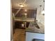 Functional kitchen with updated appliances, peninsula, and modern lighting fixtures at 4057 Crockers Lake Blvd # 15, Sarasota, FL 34238