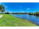 Serene lake view showcasing the community's picturesque waterfront, surrounded by lush greenery and beautiful landscaping at 4057 Crockers Lake Blvd # 15, Sarasota, FL 34238