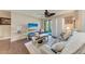 Relaxing living room featuring a comfortable seating area with a large TV screen at 4057 Crockers Lake Blvd # 15, Sarasota, FL 34238