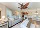Open concept living room flows into a modern kitchen and dining area with ceiling fan at 4057 Crockers Lake Blvd # 15, Sarasota, FL 34238