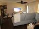Spacious living room featuring comfortable seating, TV, and access to outdoor patio at 4057 Crockers Lake Blvd # 15, Sarasota, FL 34238