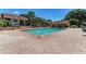 Community pool area with ample seating and a clear blue swimming pool for residents to enjoy on a sunny day at 4057 Crockers Lake Blvd # 15, Sarasota, FL 34238