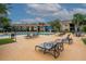 Inviting community pool area featuring lounge chairs, shaded seating, and well-maintained landscaping at 4057 Crockers Lake Blvd # 15, Sarasota, FL 34238