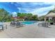 Beautiful community pool area with ample seating and well-maintained patio, perfect for relaxation and socializing at 4057 Crockers Lake Blvd # 15, Sarasota, FL 34238