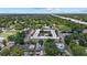 Wide aerial shot of a complex, surrounded by tree-lined streets and other homes, showcasing its location at 412 E Amelia Ave, Tampa, FL 33602