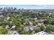 Scenic aerial view showing a vibrant city skyline nestled within a lush green landscape and residential area at 412 E Amelia Ave, Tampa, FL 33602