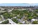 High angle of a neighborhood, near highways, full of lush trees, offering a blend of city and suburban living at 412 E Amelia Ave, Tampa, FL 33602