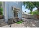 Cozy patio with brick pavers and a small landscaped yard at 412 E Amelia Ave, Tampa, FL 33602