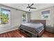 Bedroom features hardwood floors, abundant natural light, and a modern ceiling fan at 412 E Amelia Ave, Tampa, FL 33602