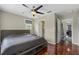 Main bedroom with hardwood floors, natural light, and en-suite bathroom access at 412 E Amelia Ave, Tampa, FL 33602