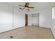 Basic bedroom with tile flooring, a ceiling fan, a closet, and a window at 417 Glen Oak Rd, Venice, FL 34293