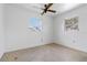 Bedroom with two windows letting in natural light and a ceiling fan at 417 Glen Oak Rd, Venice, FL 34293