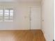 Bright entryway features wood-look flooring, a side window, and a white front door at 417 Glen Oak Rd, Venice, FL 34293