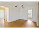 The living room has wood laminate flooring and provides access to the other rooms at 417 Glen Oak Rd, Venice, FL 34293