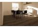 Dining room features a dining table, wood floors, a window, and white walls at 4515 Boxelder Avenue, Parrish, FL 34219