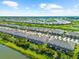 Community aerial view showing a lake, greenbelts, and neatly arranged homes in a planned development at 4644 Vignette Way, Sarasota, FL 34240