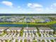 Aerial view of a neighborhood featuring a community lake at 4644 Vignette Way, Sarasota, FL 34240