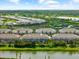 Aerial view showcasing a community with green spaces, waterfront views, and well-maintained homes at 4644 Vignette Way, Sarasota, FL 34240