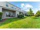 Expansive backyard with patio seating area and lush green lawn at 4644 Vignette Way, Sarasota, FL 34240