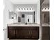 Bathroom featuring double sinks, shower, and neutral colors at 4644 Vignette Way, Sarasota, FL 34240