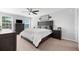 Comfortable bedroom featuring a ceiling fan, windows, and a dresser at 4644 Vignette Way, Sarasota, FL 34240