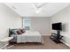 Bedroom with carpet flooring and a ceiling fan. Includes a desk, TV, and closet at 4644 Vignette Way, Sarasota, FL 34240