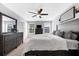 Comfortable bedroom with a ceiling fan and nice decor at 4644 Vignette Way, Sarasota, FL 34240
