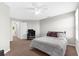 Bedroom with carpet flooring and a ceiling fan. Includes a desk, TV, and closet at 4644 Vignette Way, Sarasota, FL 34240