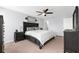 Bright bedroom with ceiling fan, dresser, and a comfortable queen bed at 4644 Vignette Way, Sarasota, FL 34240