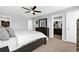 Comfortable bedroom featuring a ceiling fan, closet, and a view of a bathroom at 4644 Vignette Way, Sarasota, FL 34240