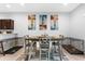 Dining room with seating for four, modern decor, and stylish chairs perfect for entertaining at 4644 Vignette Way, Sarasota, FL 34240