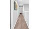 Long hallway leading to rooms, featuring neutral paint and carpet flooring at 4644 Vignette Way, Sarasota, FL 34240