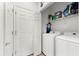 Functional laundry room with modern appliances, ample storage, and a clean, organized layout at 4644 Vignette Way, Sarasota, FL 34240