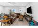 Welcoming living room with a large window, plush seating, and a cozy atmosphere at 4644 Vignette Way, Sarasota, FL 34240