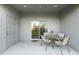 Inviting outdoor patio with a table and four chairs, perfect for relaxing and enjoying the fresh air at 4644 Vignette Way, Sarasota, FL 34240