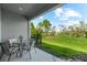 Inviting covered patio area with comfortable seating, perfect for outdoor dining and relaxation at 4644 Vignette Way, Sarasota, FL 34240