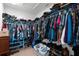 Organized walk-in closet featuring ample storage space for clothing and shoes at 4644 Vignette Way, Sarasota, FL 34240