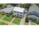 Aerial view of the home with lush landscaping, a garage, and a paved driveway at 480 28Th N Ave, St Petersburg, FL 33704