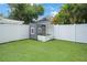 Charming backyard features a quaint playhouse and white vinyl fence at 480 28Th N Ave, St Petersburg, FL 33704